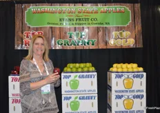 Kristina Conrad with Evans Fruit Company shows a Red Delicious apple that is shipped all over the globe.